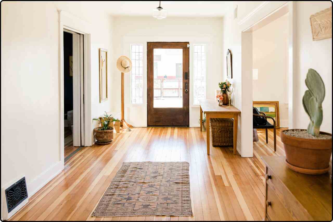 Modern home interior with sleek, contemporary furniture, open floor plan, and large windows allowing natural light to fill the space.